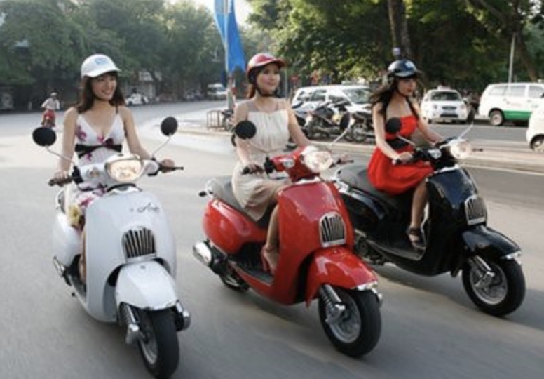 Three sexy Vietnamese girls on Motorbikes